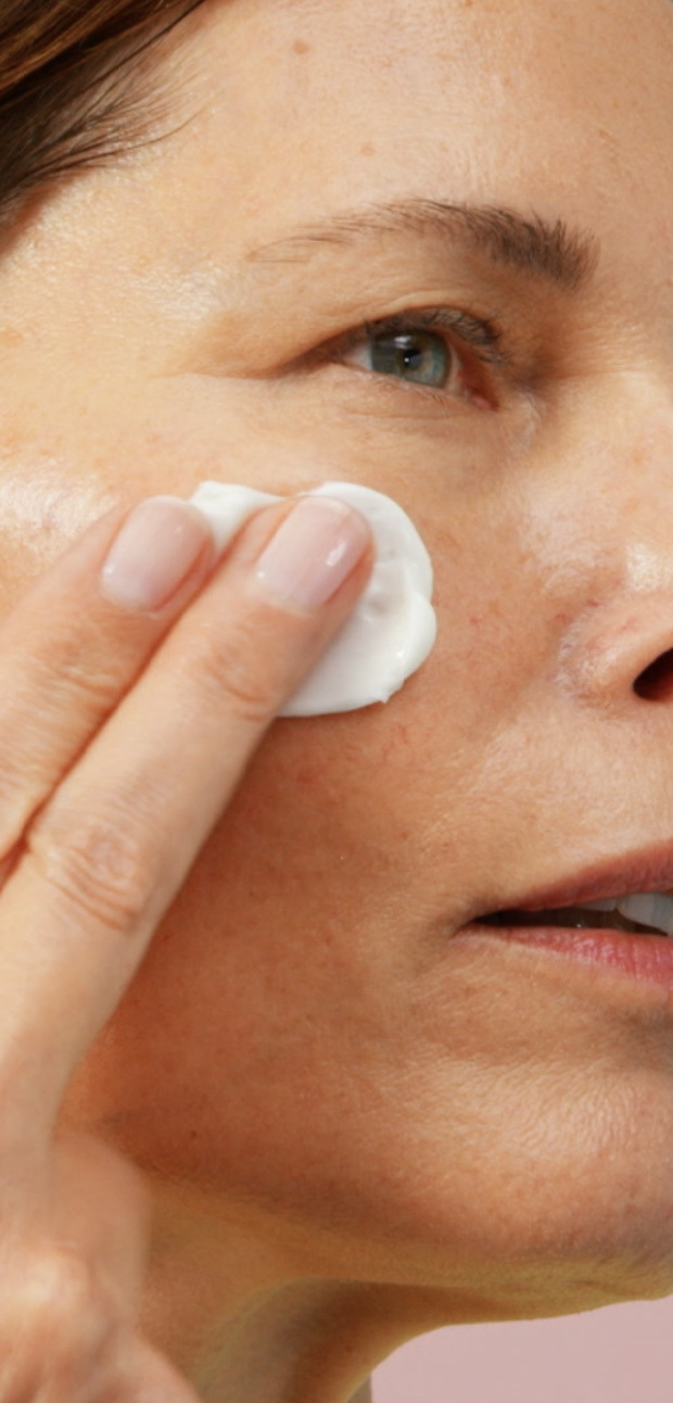 Woman applying Bora Barrier Repair Cream to cheek Copy overlay: 